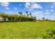 Expansive backyard featuring lush grass and landscaping at 5283 Everlong Dr, Apollo Beach, FL 33572