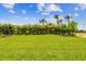Beautiful backyard with green lawn and landscaped borders at 5283 Everlong Dr, Apollo Beach, FL 33572