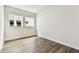 Bedroom with wood-look floors and a neutral color palette, offering a blank canvas for personalization at 5283 Everlong Dr, Apollo Beach, FL 33572