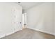 Bedroom featuring double doors and neutral carpeting at 5283 Everlong Dr, Apollo Beach, FL 33572