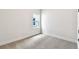 Empty bedroom featuring a window and neutral carpeting at 5283 Everlong Dr, Apollo Beach, FL 33572