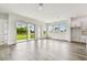 Spacious living room with modern finishes, sliding glass doors to the backyard, and plenty of natural light at 5283 Everlong Dr, Apollo Beach, FL 33572