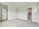 Main bedroom features plush carpeting and a doorway leading to an ensuite bathroom at 5283 Everlong Dr, Apollo Beach, FL 33572