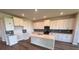 Bright, spacious kitchen features a large island, stainless steel appliances, and white cabinets at 4319 Pullet Ct, Bradenton, FL 34211