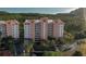 An aerial shot of the condo buildings surrounded by trees and tropical landscaping at 12077 Gandy N Blvd # 344, St Petersburg, FL 33702