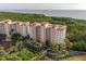 Bird's eye view of condos with palm tree landscaping, near conservation and a bay view at 12077 Gandy N Blvd # 344, St Petersburg, FL 33702