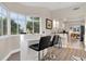 Stylish bar with seating area near a window with a view of trees and plants outside at 12077 Gandy N Blvd # 344, St Petersburg, FL 33702