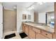 Large bathroom boasts double sinks, granite countertops, and tiled walk-in shower at 12077 Gandy N Blvd # 344, St Petersburg, FL 33702