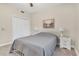 Cozy bedroom featuring carpet, a queen bed, and a double door closet at 12077 Gandy N Blvd # 344, St Petersburg, FL 33702