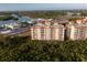 Exterior view of the building showcasing the surrounding greenery and waterfront view at 12077 Gandy N Blvd # 344, St Petersburg, FL 33702