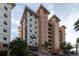 Beautiful exterior of the building, featuring balconies and a beige color scheme with palm trees at 12077 Gandy N Blvd # 344, St Petersburg, FL 33702