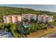Scenic view of condominiums surrounded by lush vegetation with glimpses of the ocean in the background at 12077 Gandy N Blvd # 344, St Petersburg, FL 33702