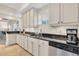 Bright kitchen featuring granite countertops, stainless steel appliances, and modern cabinetry at 12077 Gandy N Blvd # 344, St Petersburg, FL 33702