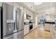 Bright kitchen features stainless steel appliances and granite countertops and opens to the living area at 12077 Gandy N Blvd # 344, St Petersburg, FL 33702