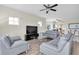 Comfortable living room featuring modern sofas, a sleek entertainment center, and lots of natural light at 12077 Gandy N Blvd # 344, St Petersburg, FL 33702