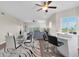 Open living space with wood floors, stylish furnishings and large windows overlooking mature landscaping at 12077 Gandy N Blvd # 344, St Petersburg, FL 33702