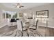 Open living area boasts a stylish dining table, counter seating, and bright natural light at 12077 Gandy N Blvd # 344, St Petersburg, FL 33702