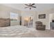 Bright main bedroom features balcony access, ceiling fan and neutral tones at 12077 Gandy N Blvd # 344, St Petersburg, FL 33702