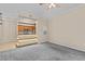 Neutral living room with carpet, view of kitchen, ceiling fan, and access to other rooms at 17108 Carrington Park Dr # 710, Tampa, FL 33647