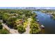 Aerial view of a waterfront property showcasing the home and its proximity to the river at 2517 N Riverside Dr, Tampa, FL 33602