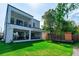 Expansive backyard with lush green grass, patio, and a play area, perfect for outdoor enjoyment at 2517 N Riverside Dr, Tampa, FL 33602