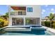 Modern backyard features a pool, hot tub, and covered outdoor kitchen at 2517 N Riverside Dr, Tampa, FL 33602