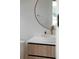 Modern bathroom featuring a vessel sink, gold faucet, round mirror, and stylish vanity at 2517 N Riverside Dr, Tampa, FL 33602