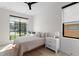 Bright bedroom featuring a ceiling fan, large window and neutral decor at 2517 N Riverside Dr, Tampa, FL 33602