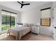 Well-lit bedroom with a neutral palette, large window, and modern furnishings at 2517 N Riverside Dr, Tampa, FL 33602