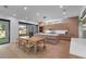 Open-concept kitchen with wood cabinets, a large island, and dining area at 2517 N Riverside Dr, Tampa, FL 33602