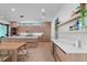 Modern kitchen with wood cabinets, white countertops, and a large island, open to the dining area at 2517 N Riverside Dr, Tampa, FL 33602