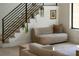 Stylish living room with a modern staircase and comfortable seating area at 2517 N Riverside Dr, Tampa, FL 33602