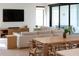 Open-concept living and dining area with modern furniture and sliding glass doors at 2517 N Riverside Dr, Tampa, FL 33602