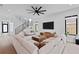Bright living room with modern furnishings, lots of natural light, and open staircase at 2517 N Riverside Dr, Tampa, FL 33602