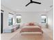 Large main bedroom with seating area, neutral color palette, and lots of natural light at 2517 N Riverside Dr, Tampa, FL 33602