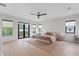 Expansive main bedroom suite with natural light, ceiling fan and a balcony at 2517 N Riverside Dr, Tampa, FL 33602