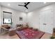 Cozy sitting area with a plush sofa, elegant rug, and contemporary ceiling fan for ultimate comfort at 2517 N Riverside Dr, Tampa, FL 33602