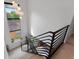 Bright staircase featuring modern black railings and a large window providing natural light at 2517 N Riverside Dr, Tampa, FL 33602