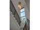 Staircase with a modern railing and a large window providing natural light at 2517 N Riverside Dr, Tampa, FL 33602