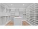 Spacious walk-in closet with custom shelving and a central island at 2517 N Riverside Dr, Tampa, FL 33602