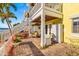 Inviting back patio with brick flooring, comfortable seating, and stylish white wicker storage and furniture at 3889 Pompano Se Dr # A, St Petersburg, FL 33705