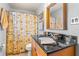 Cozy bathroom featuring a vanity with granite countertop at 3889 Pompano Se Dr # A, St Petersburg, FL 33705