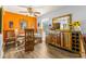 Eclectic dining area with unique wood furniture, a large mirror, and ample natural light at 3889 Pompano Se Dr # A, St Petersburg, FL 33705