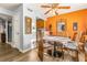 Stylish dining area with a round table, wooden chairs, and an open view to the kitchen at 3889 Pompano Se Dr # A, St Petersburg, FL 33705