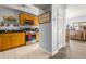 Functional kitchen featuring stainless steel appliances, tile flooring, and wood cabinetry at 3889 Pompano Se Dr # A, St Petersburg, FL 33705