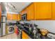 Well-equipped kitchen features stainless steel appliances and black countertops at 3889 Pompano Se Dr # A, St Petersburg, FL 33705