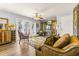 Inviting living room with a plush sofa, glass table, and french doors letting in lots of light at 3889 Pompano Se Dr # A, St Petersburg, FL 33705