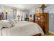 Well-lit main bedroom with dressers, bedside tables, and window at 3889 Pompano Se Dr # A, St Petersburg, FL 33705