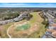 Scenic aerial view of the community golf course with lush green fairways and well-maintained landscaping at 4605 Lisette Cir, Brooksville, FL 34604