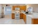 Bright kitchen featuring white appliances, ample cabinet space, and a clean, functional layout at 4605 Lisette Cir, Brooksville, FL 34604
